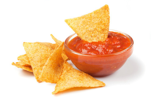 Nachos corn chips with fresh homemade salsa isolated on white
