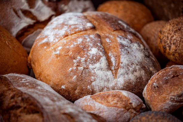 Freshly baked natural bread is on the kitchen table.