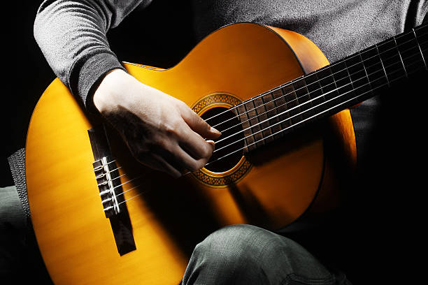 istock Acoustic guitar guitarist playing. 134843391