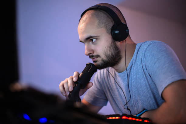 istock Teenage boy playing multiplayer online games using desktop PC Close-up 1348438425
