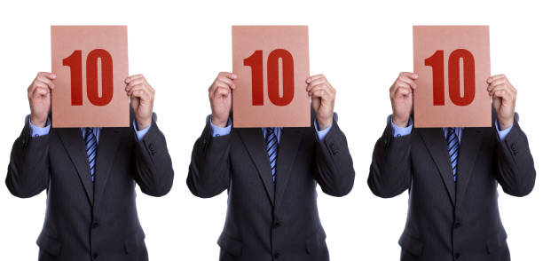 istock Three men all holding signs with 10 in front of their faces 134845283