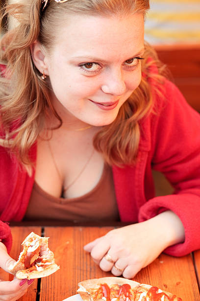 istock girl eating pizza 134845805