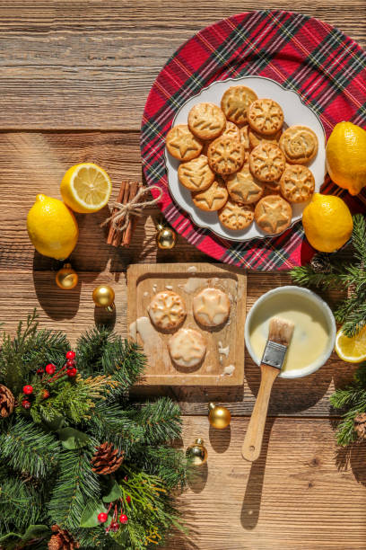 istock Baking christmas cookies with lemon frosting 1348458206