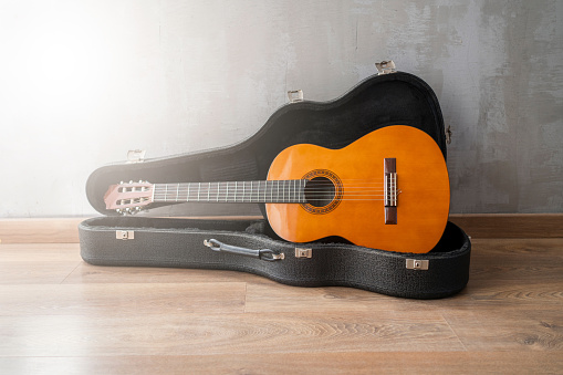 Guitar on hard Case .Classic acoustic guitar concept