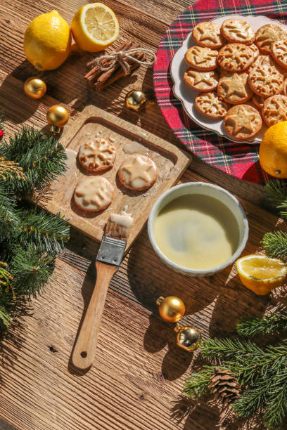 istock Baking christmas cookies with lemon frosting 1348462983
