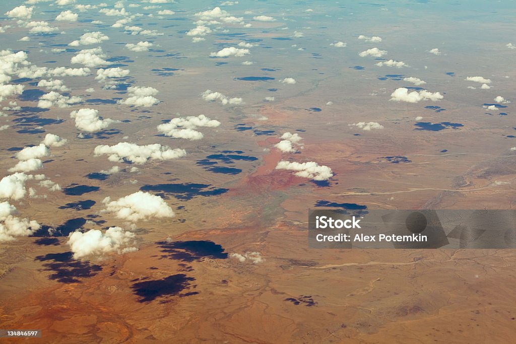 Aerial shot: Mongolia, desert landscape with cloud's shadows Fly from China to Russia.  Aerial View Stock Photo