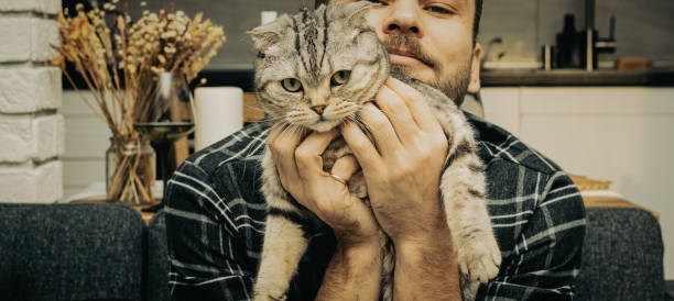 istock The man cuddles his cat. 1348479554