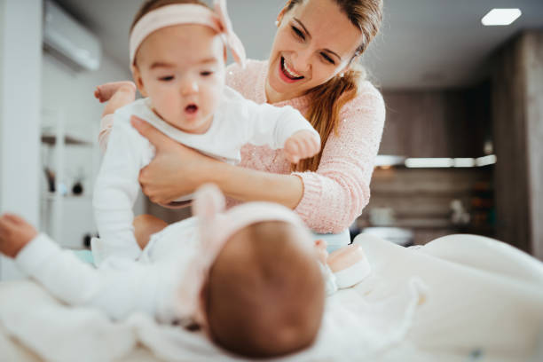 istock Young mother having fun with cute baby 1348483356