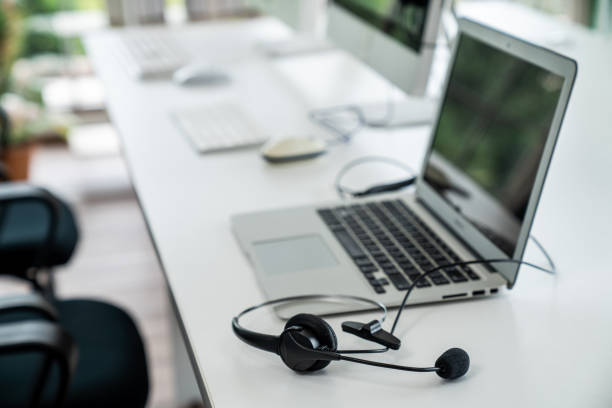 istock Headset and customer support equipment at call center ready for actively service 1348486909