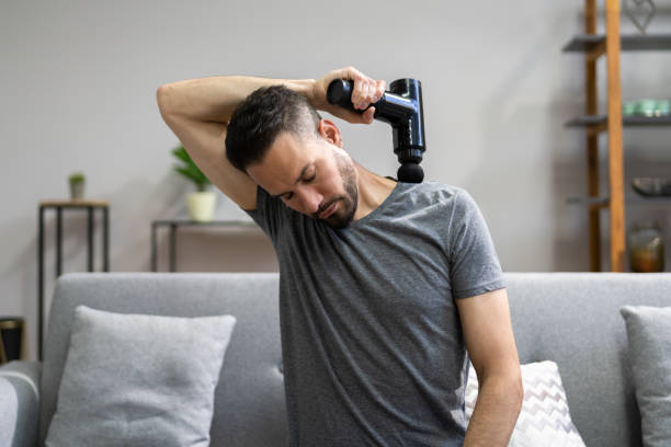 massaggio pistola macchina terapia di recupero - gun foto e immagini stock