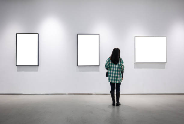 istock Young  woman looking at an art gallery 1348498417