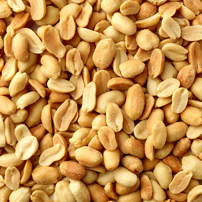 roasted salted peanut background, top view