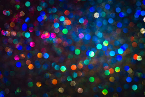 istock bokeh effect glitter colorful blurred abstract background for birthday, anniversary, wedding, new year eve or Christmas 1348516643