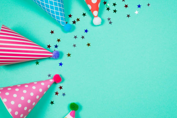 istock Colorful birthday caps on a blue background. Top view. 1348522728