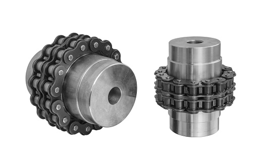 Chain gear is driven by an electric motor for industrial use on white background