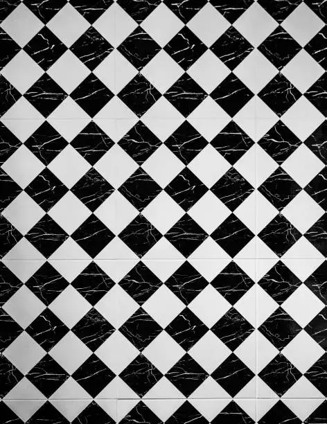 Photo of Tiles. Vintage black and white tiles texture background floor.