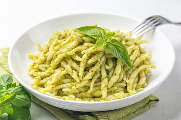 Trofie al pesto, italian pasta with pesto sauce. Close-up. stock photo