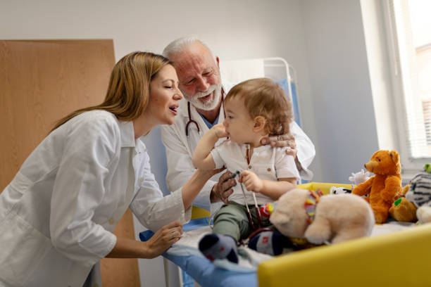 istock Doctor examining baby boy with stethoscope 1348538416