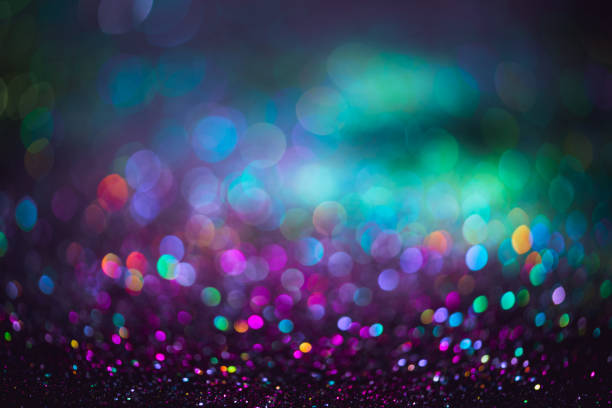 istock bokeh effect glitter colorful blurred abstract background for birthday, anniversary, wedding, new year eve or Christmas 1348538555
