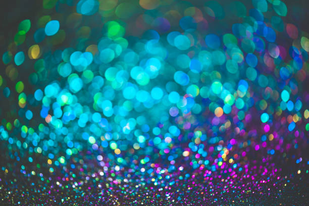 istock bokeh effect glitter colorful blurred abstract background for birthday, anniversary, wedding, new year eve or Christmas 1348538634