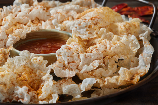 Crispy Fried Rice Paper Chips with a Dusting of Paprika, Garlic and Salt with a Sweet Thai Chili Dipping Sauce