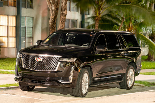 Night photo of a Cadillac Escalade luxury suv limo used for Uber and Lyft stock photo