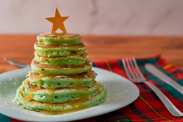 istock Christmas tree shaped pancakes on the table. Christmas breakfast concept 1348552523