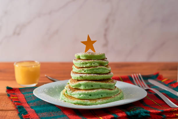 istock Christmas tree shaped pancakes on the table. Christmas breakfast concept 1348553094