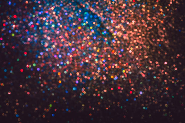 istock bokeh effect glitter colorful blurred abstract background for birthday, anniversary, wedding, new year eve or Christmas 1348554828