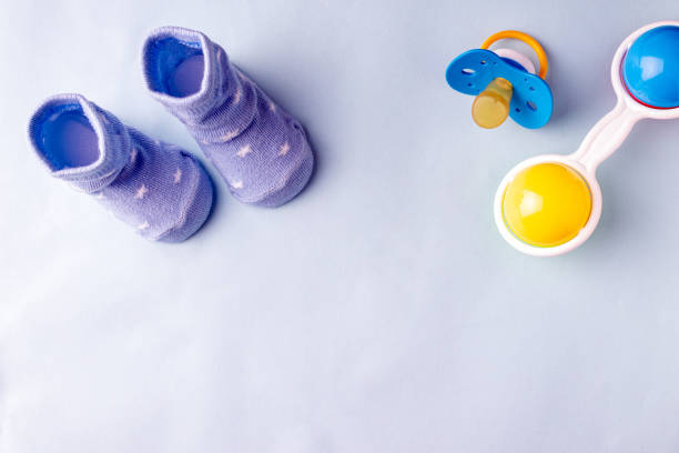 istock socks and toys for babies, place for text 1348567520