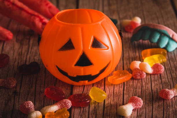 istock Halloween pumpkin basket with candy for children. Selective focus. Copy space. 1348567721