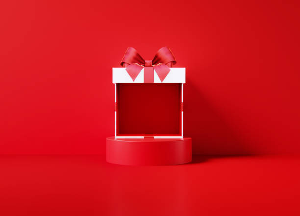 istock White Giftbox Sitting On A Red Podium Before  Red Background 1348570339