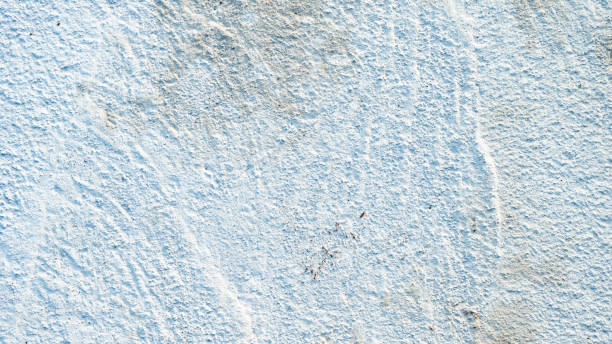 istock Grey concrete wall. Old gray concrete or cement wall textured background 1348572718