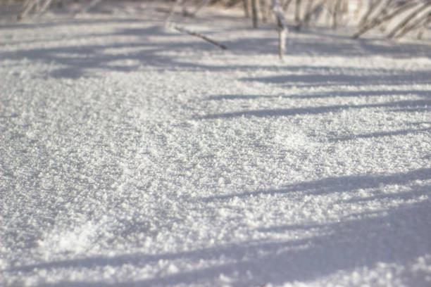 istock Natural winter background with snow drifts and falling snow 1348572776