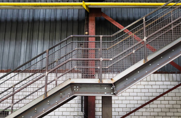 istock Close up view on metallic stairs at a industrial building. 1348574054