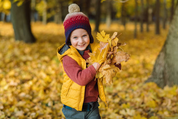 Child playing in autumn nature