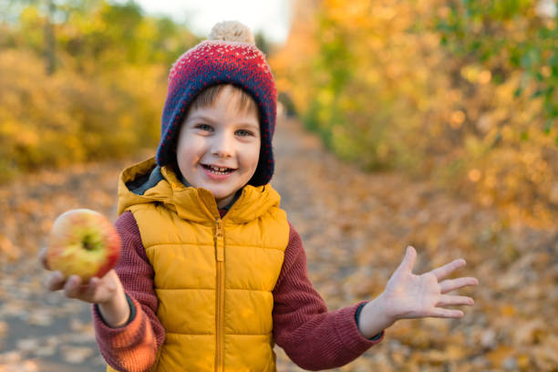Child playing in autumn nature