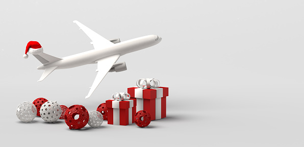 Traveling at Christmas. Airplane with Santa Claus hat, balls and presents.  Copy space. 3D illustration.