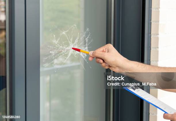 Man Checking To Repair Glass In A House Stock Photo - Download Image Now - Shattered Glass, Window, Glass - Material