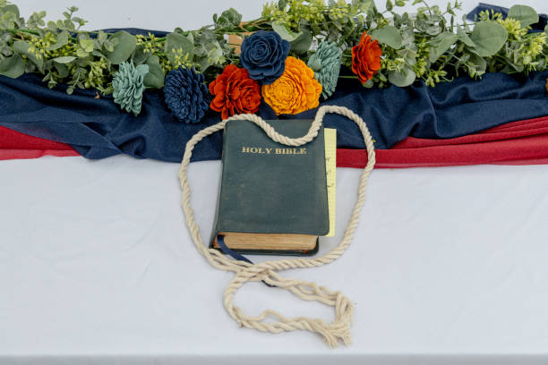 istock Wedding day bible on a table with flowers 1348595065