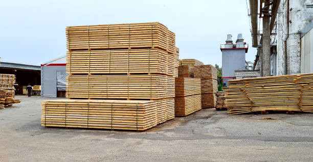 istock Packed boards, lumber piles in the finished goods warehouse 1348595514