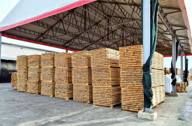 istock Packed boards, lumber piles in the finished goods warehouse 1348595690