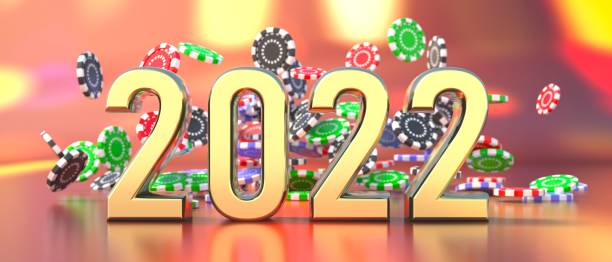 istock 2022 New Year celebration and poker chips falling on casino table. 3d illustration 1348595719