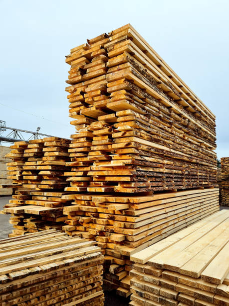 istock Unedged and edged boards in stacks. Finished goods warehouse 1348601242