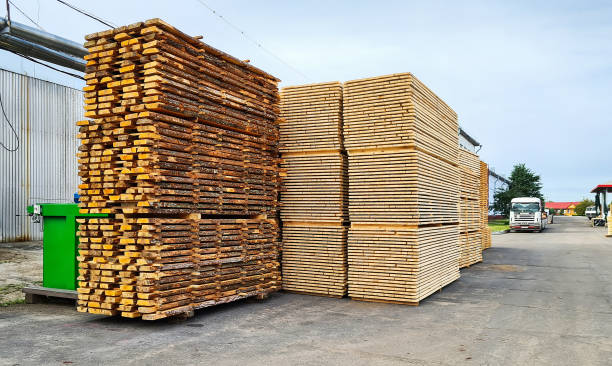 istock Unedged and edged boards in stacks. Finished goods warehouse 1348616677