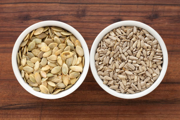 istock Pumpkin and sunflower seeds 1348617267
