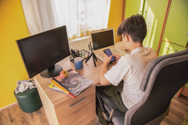 istock Young boy turning off his phone 1348642964