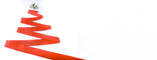 istock Christmas tree made of red ribbon on a white background 1348654736