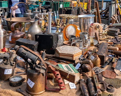 A market stall in Swaffham, Norfolk, Eastern England, containing antiques and various items of bric-a-brac and collectables. The Saturday market and street auction are a traditional event in Swaffham.