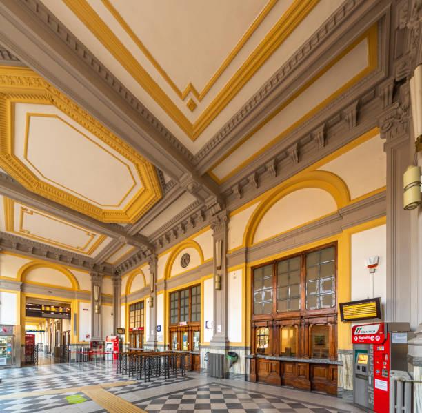 hall of the ticket offices of the Cuneo railway station Cuneo, Piedmont, Italy - October 22, 2021: Historic decorated hall of the ticket offices of the Cuneo railway station on the Turin-Nice railway line cuneo stock pictures, royalty-free photos & images